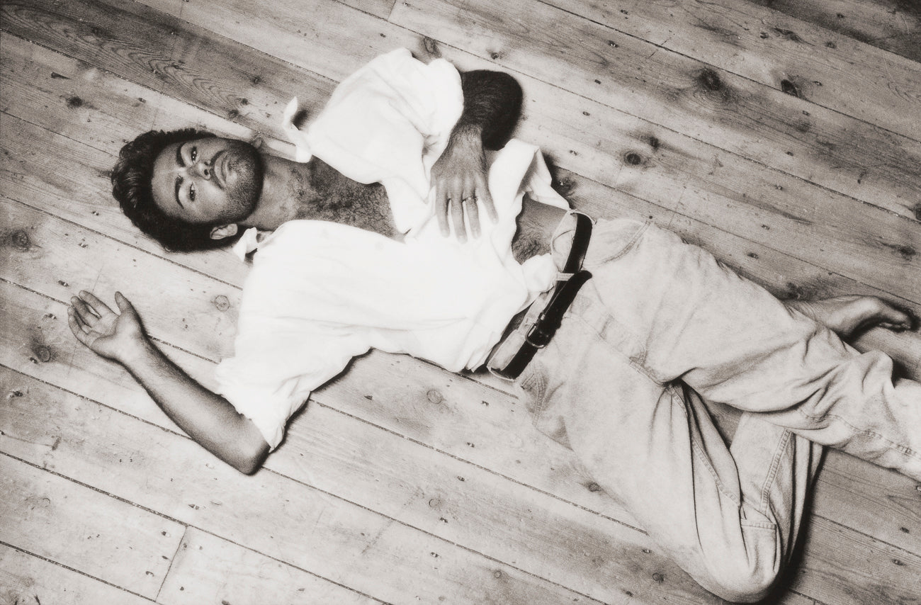 George Michael - Laying on wood floor