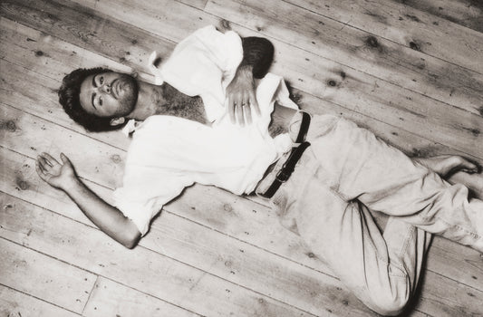 George Michael - Laying on wood floor